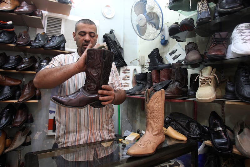 galleries/2013/04/04/man-heels-a-short-history/130403-man-heels-cowboy-boots-iraq_wxgz9b