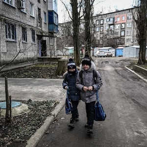 young kids walking in the street