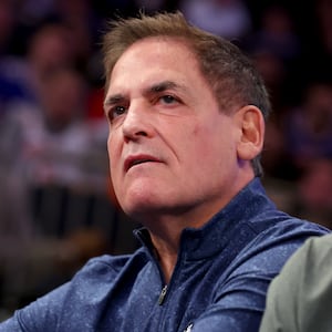 Mark Cuban stares forward at an NBA game. 