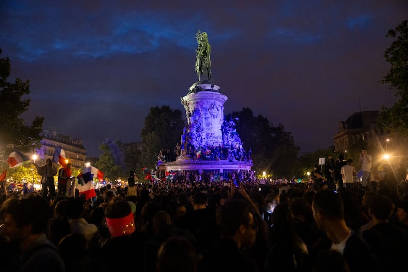 Supporters of the left wing union, the New Popular Front, gather at the Place de la Republique following the defeat of the far-right in France's legislative elections.