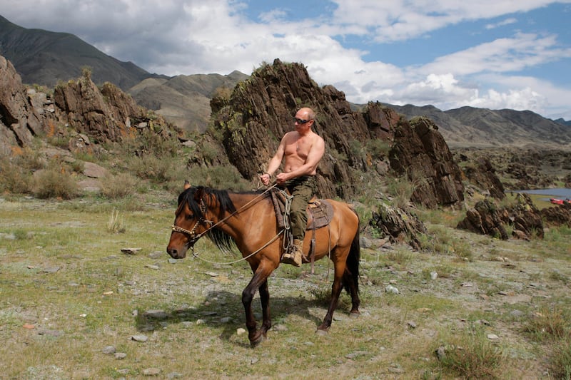 galleries/2013/09/05/17-photos-of-putin-schmoozing-with-animals-photos/130904-putin-topless-horse_u95suj