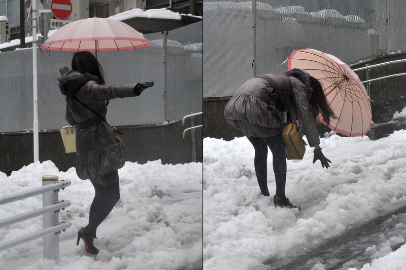 galleries/2014/02/18/snowstorm-cripples-japan-photos/140218-japan-snowstorm-8_q0d7bb