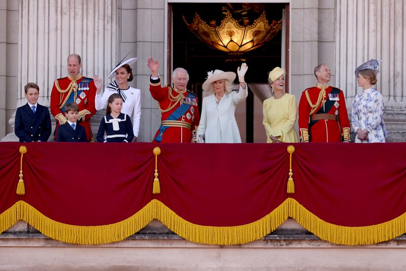 King Charles, Queen Camilla, William, Prince of Wales, Catherine, Princess of Wales, Prince George, Princess Charlotte, Prince Louis, Sophie, Duchess of Edinburgh, Prince Edward, Duke of Edinburgh, Lady Louise Windsor, appear at Buckingham Palace.