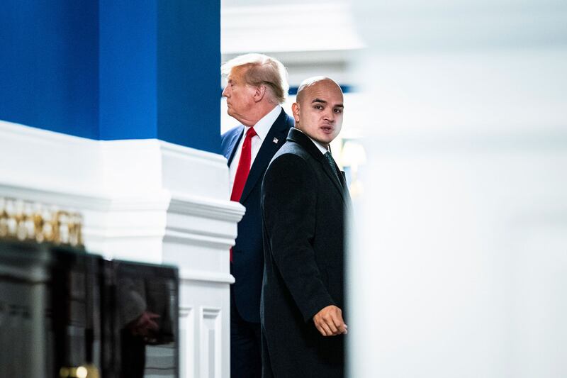 Walt Nauta arrives with former President Donald Trump before Trump speaks to reporters and members of the media at the Waldorf Astoria hotel.