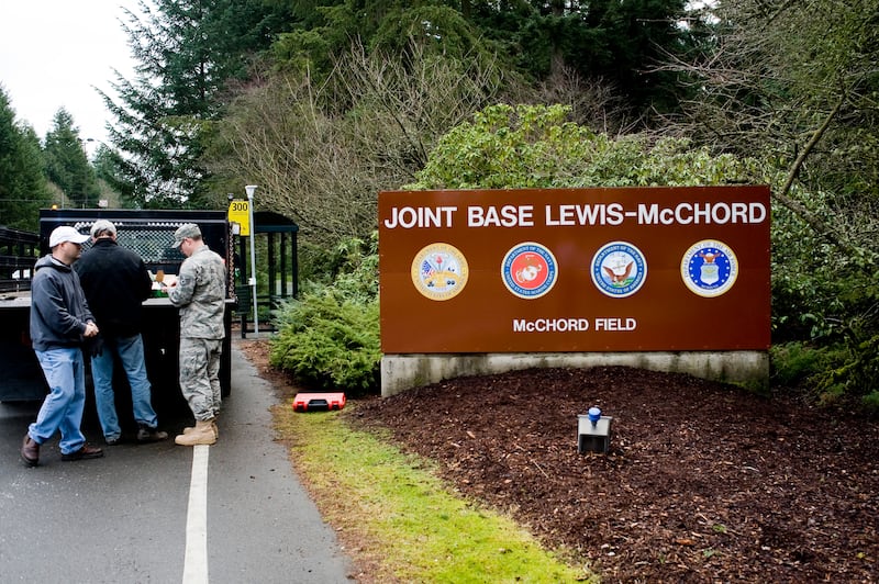 A picture of a road sign reading: Joint Base Lewis-McChord.