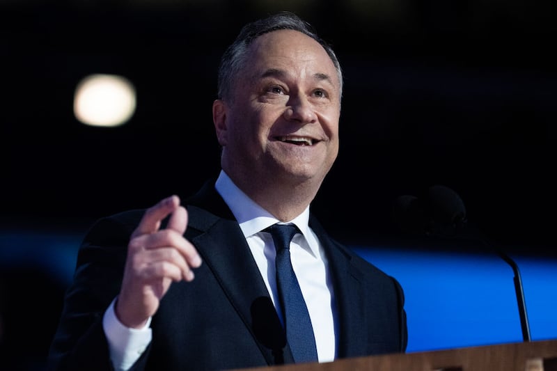 Second gentleman Doug Emhoff smiles as he speaks on the second night of the Democratic National Convention in Chicago.