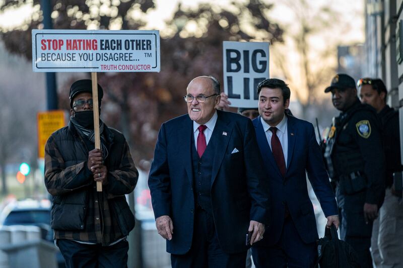 Former New York Mayor Rudy Giuliani departs the U.S. District Courthouse after he was ordered to pay $148 million in his defamation case in Washington, U.S., December 15, 2023