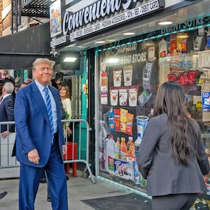 A photo of Donald Trump smiling as he walks into a bodega in Manhattan. 