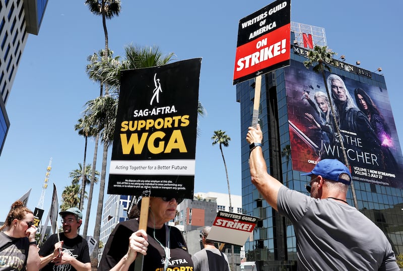 A photo including members of the SAG-AFTRA supporting the WGA Strike in Los Angeles.