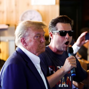 Rep. Matt Gaetz uses a microphone as Republican presidential candidate and former U.S. President Donald Trump campaigns at the Iowa State Fair in Des Moines, Iowa