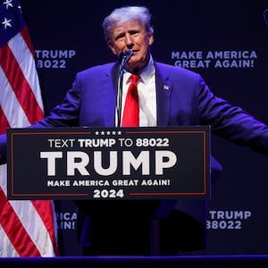 Former U.S. President Donald Trump speaks during a campaign rally with supporters in Davenport, Iowa.