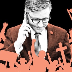 A photo illustration of Mike Johnson surrounded by silhouettes of angry mobs holding crosses, signs, and flags.