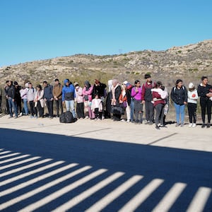 A picture of migrants at the U.S./Mexico border.