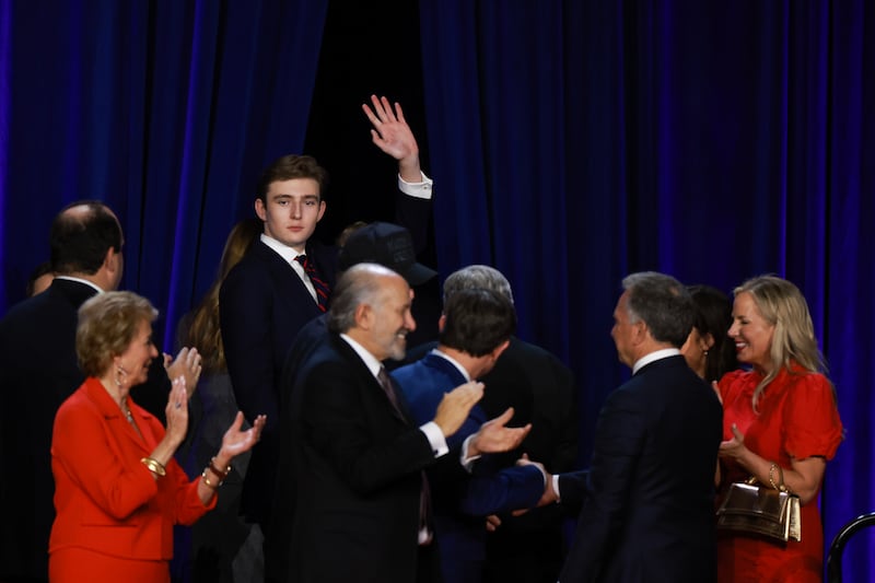 Barron Trump waves to supporters as he departs an election night event for Republican presidential nominee, former U.S. President Donald Trump at the Palm Beach Convention Center on November 06, 2024 in West Palm Beach, Florida.