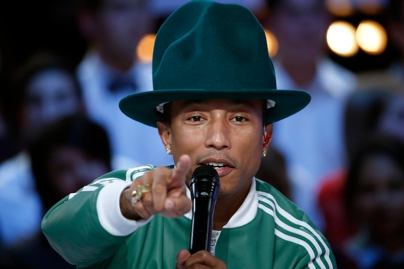 articles/2014/03/03/girl-review-pharrell-s-pleasant-unchallenging-dive-into-the-mainstream/140302-pharrell-album-tease_t6kdm5