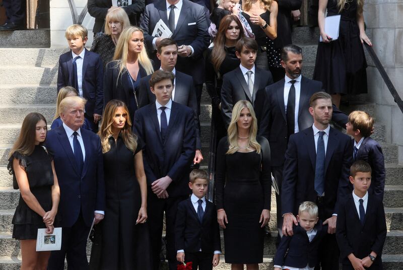 A line-up showing Trump and his extended family on the steps of a church