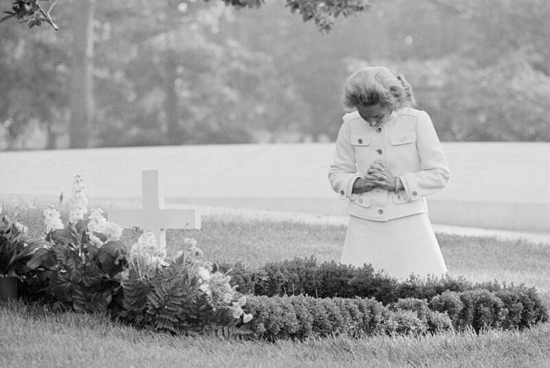 Ethel Kennedy visits Arlington National Cemetery in the early morning hours and prays at the grave of her husband, Robert F. Kennedy, on the second anniversary of his death.