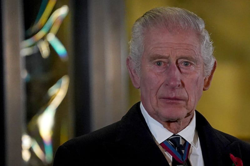 King Charles reacts after unveiling statues of Britain's Queen Elizabeth and Prince Phillip upon his and Queen Camilla arrival to attend the Royal British Legion Festival of Remembrance at the Royal Albert Hall in London, Britain, November 11, 2023.