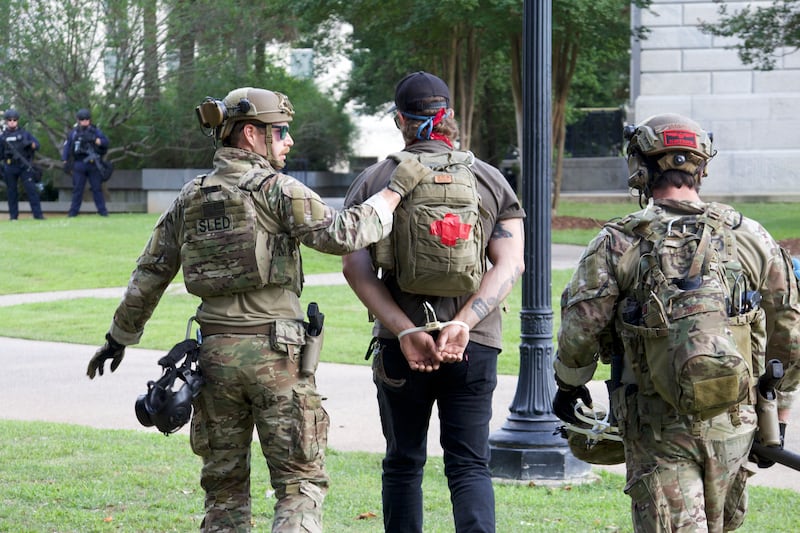 State_trooper_lead_away_a_volunteer_medic_at_a_protest_in_Columbia_on_June_1_2020._David_Axe_photo_copy_d1iwnx