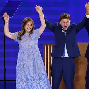 Hope, Gus, Tim and Gwen Walz on stage at the DNC