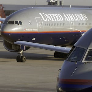 A photo of a United Airlines plane on the tarmac.