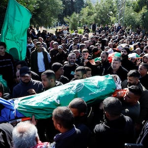 Palestinians attend a funeral of those killed in an airstrike in Jenin.