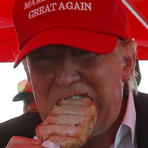 Donald Trump eats a porkchop.