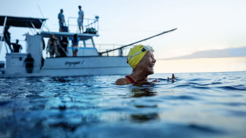 A photo including a film still of Annette Bening as Diana Nyad in the film NYAD on Netflix