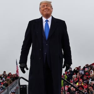 Donald Trump smiles during a campaign event at Capital Region International Airport in Lansing, Michigan, Oct. 27, 2020.