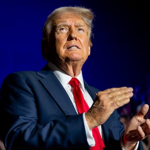 U.S. Republican Presidential nominee former President Donald Trump greets attendees upon arrival at his campaign rally at the Bojangles Coliseum on July 24, 2024 in Charlotte, North Carolina.