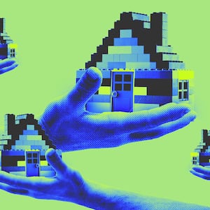 A photo illustration of hands holding houses made from blocks