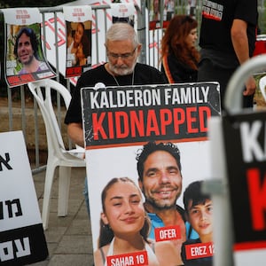 A person looks on as the families and supporters of hostages held in Gaza by Hamas gather to raise awareness and demand their immediate release in Tel Aviv, Israel November 22, 2023.