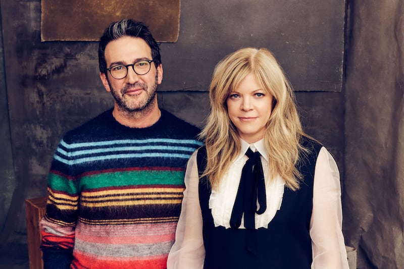 Stephanie Savage and Josh Schwartz pose for a portrait