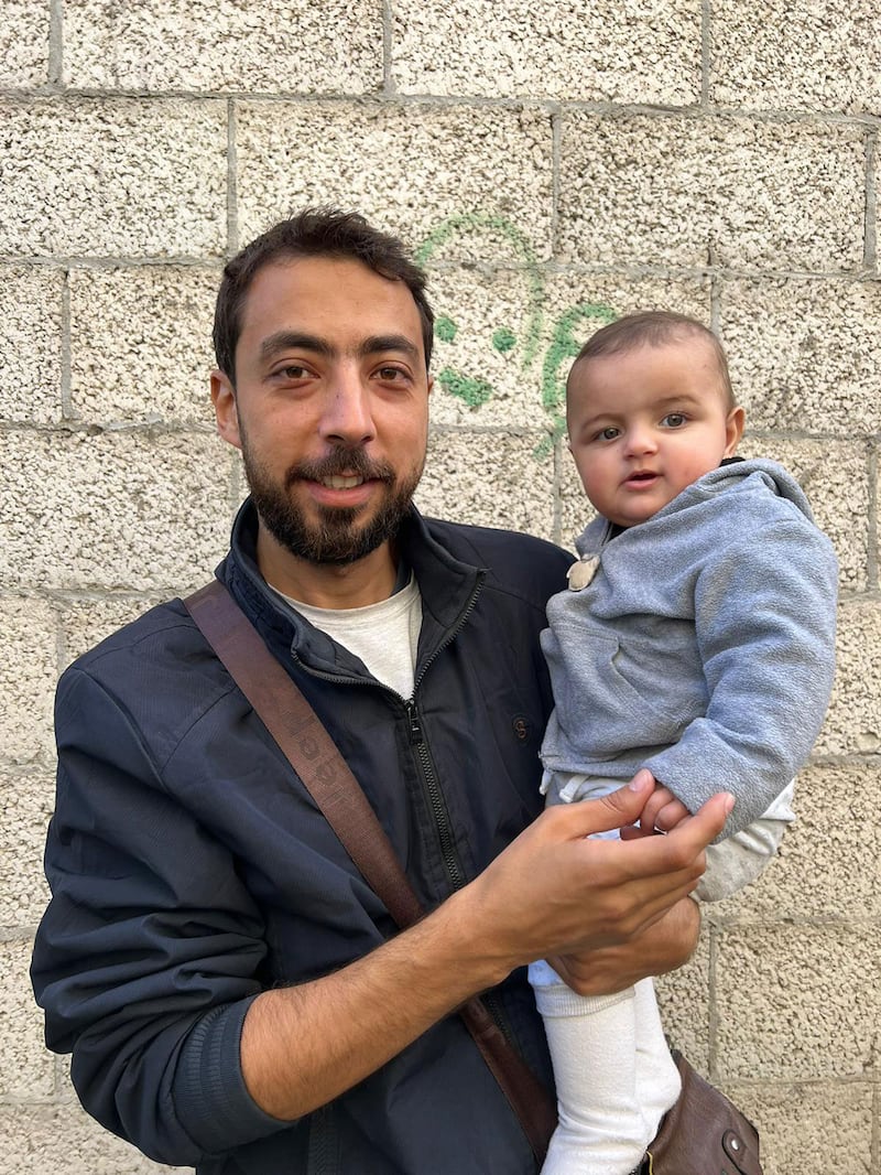 Photograph of a Yahia Barzaq and baby