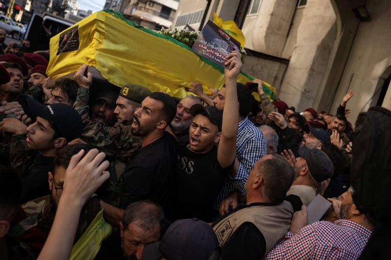 Mourners carry the coffin of Fuad Shukr in Beirut’s southern suburbs