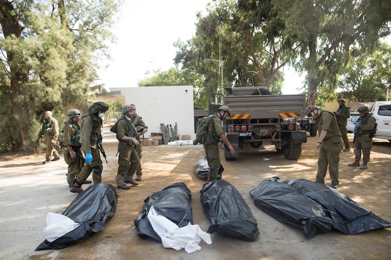 A photo including Israeli soldiers near the border of Gaza