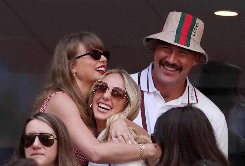 Taylor Swift and Brittany Mahomes embrace at the U.S. Open.