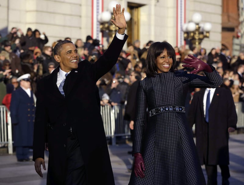 galleries/2013/01/21/president-obama-s-second-inauguration-photos/130121-barack-michelle-parade-wave_ktrwno