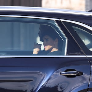 Prince Harry, Duke of Sussex and Meghan, Duchess of Sussex depart in a car after the procession for the Lying-in State of Queen Elizabeth II on September 14, 2022.