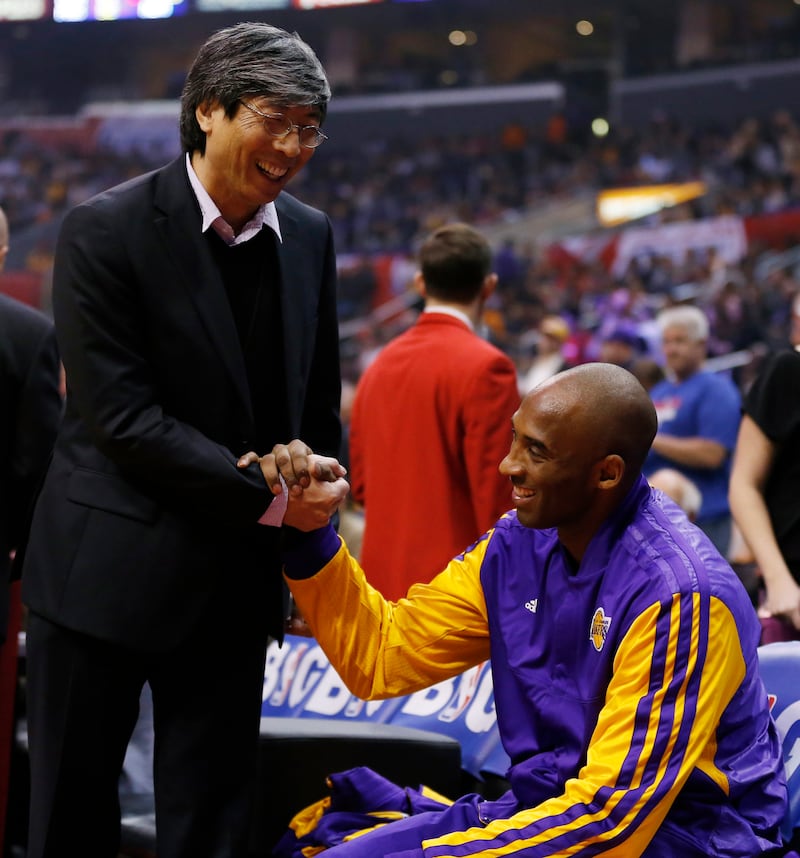 Patrick Soon-Shiong shares a smile with Los Angeles Lakers' Kobe Bryant