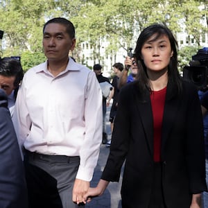 Linda Sun, a former aide to New York State Governor Kathy Hochul, exits Brooklyn Federal court with Chris Hu