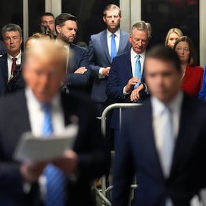 Alabama AG, Steve Marshall, second from left, Sen. J.D. Vance, R-Ohio, Eric Trump, Sen. Tommy Tuberville, R-Ala., Iowa AG Brenna Bird and Sen. Nicole Malliotakis, R-N.Y.  listen listen as Donald Trump speaks ahead of court during his hush money trial.