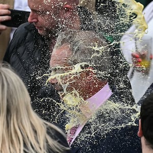 Nigel Farage is hit in the face with a milkshake while campaigning in Clacton. 