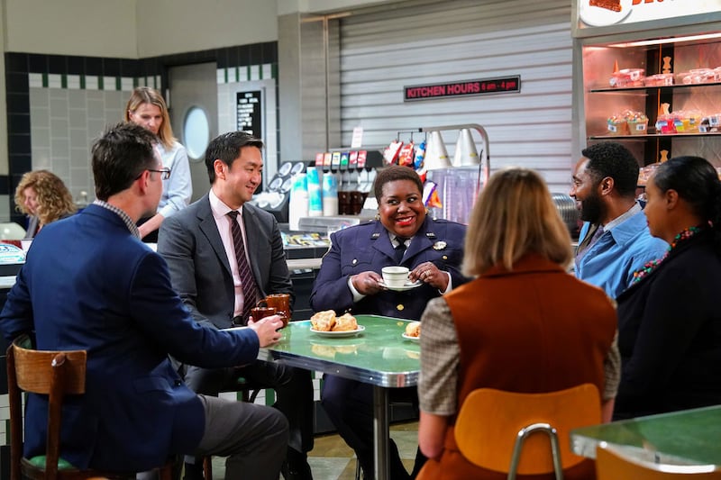 Lacretta and Dwayne Colbert sit around a table in a still from ‘Night Court’