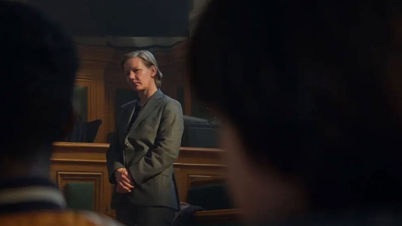 Sandra Huller standing in a court room in a still from ‘Anatomy of a Fall’