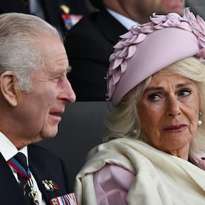 King Charles III and Queen Camilla react during the U.K.’s national commemorative event for the 80th anniversary of D-Day, hosted by the Ministry of Defence on Southsea Common on June 5, 2024, in Portsmouth, England. 