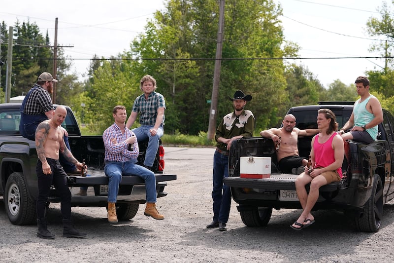 The cast of 'Letterkenny' sitting in the back of trucks