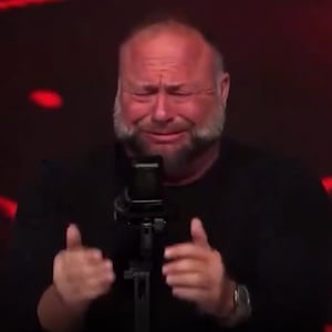 Screenshot of Alex Jones crying.