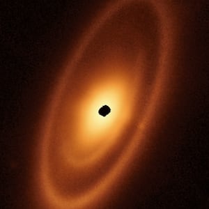 a young star called Fomalhaut looking like an orange nova surrounded by rings upon rings