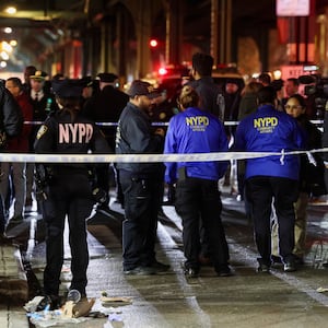 New York Police Department (NYPD) personnel investigate the scene of a shooting at the Mount Eden Avenue subway station in the Bronx borough of New York City, U.S. February 12, 2024.